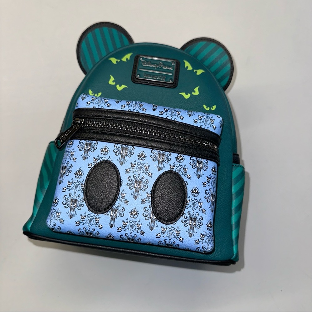 Loungefly Disney’s Haunted Mansion Teal and Light Blue Backpack with Ear Accents